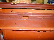 LR - 144002080 - Bulkhead - red-oxide - view of passenger side (rhs) hole for ventilation hose
